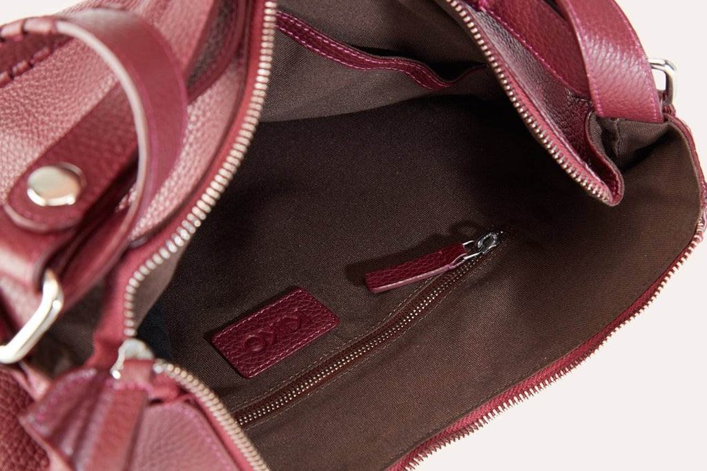 Genuine pebble leather versatile shoulder bag with adjustable straps and multiple pockets for work and travel