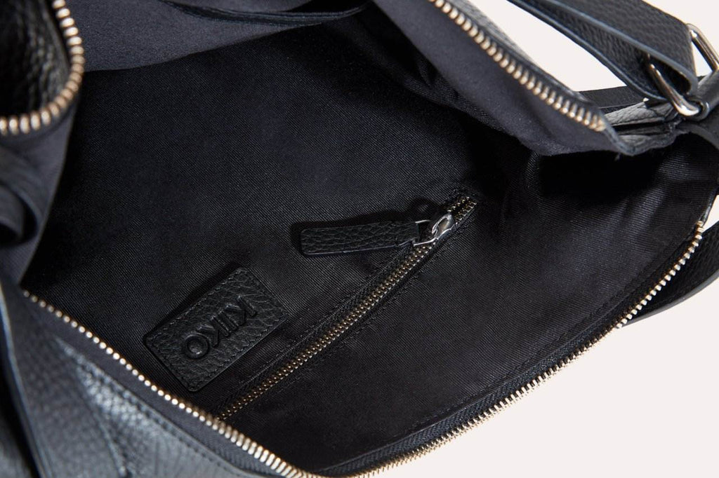 Genuine Pebble Leather versatile shoulder bag with adjustable straps and multiple pockets for work and travel