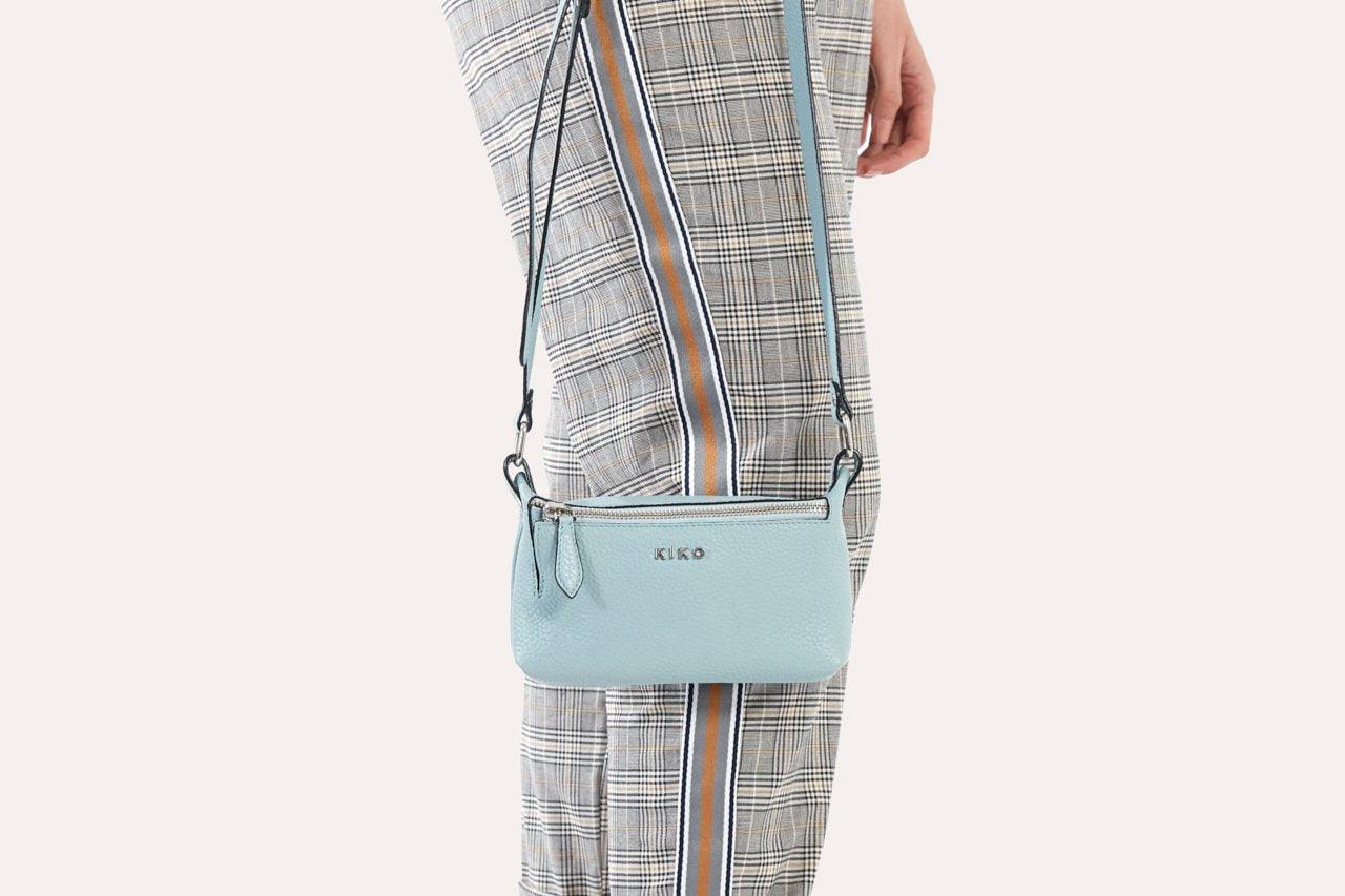 Compact genuine pebble leather crossbody bag with adjustable strap and zipper pockets