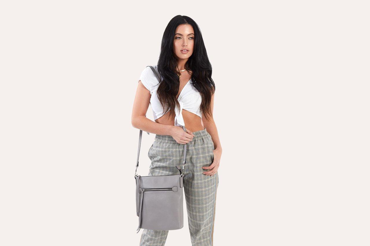 Kiko genuine pebble leather crossbody bag with external zipper pocket and adjustable strap