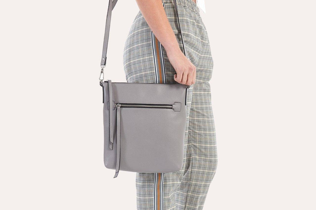 Kiko pebble leather crossbody bag with external zipper pocket and adjustable strap