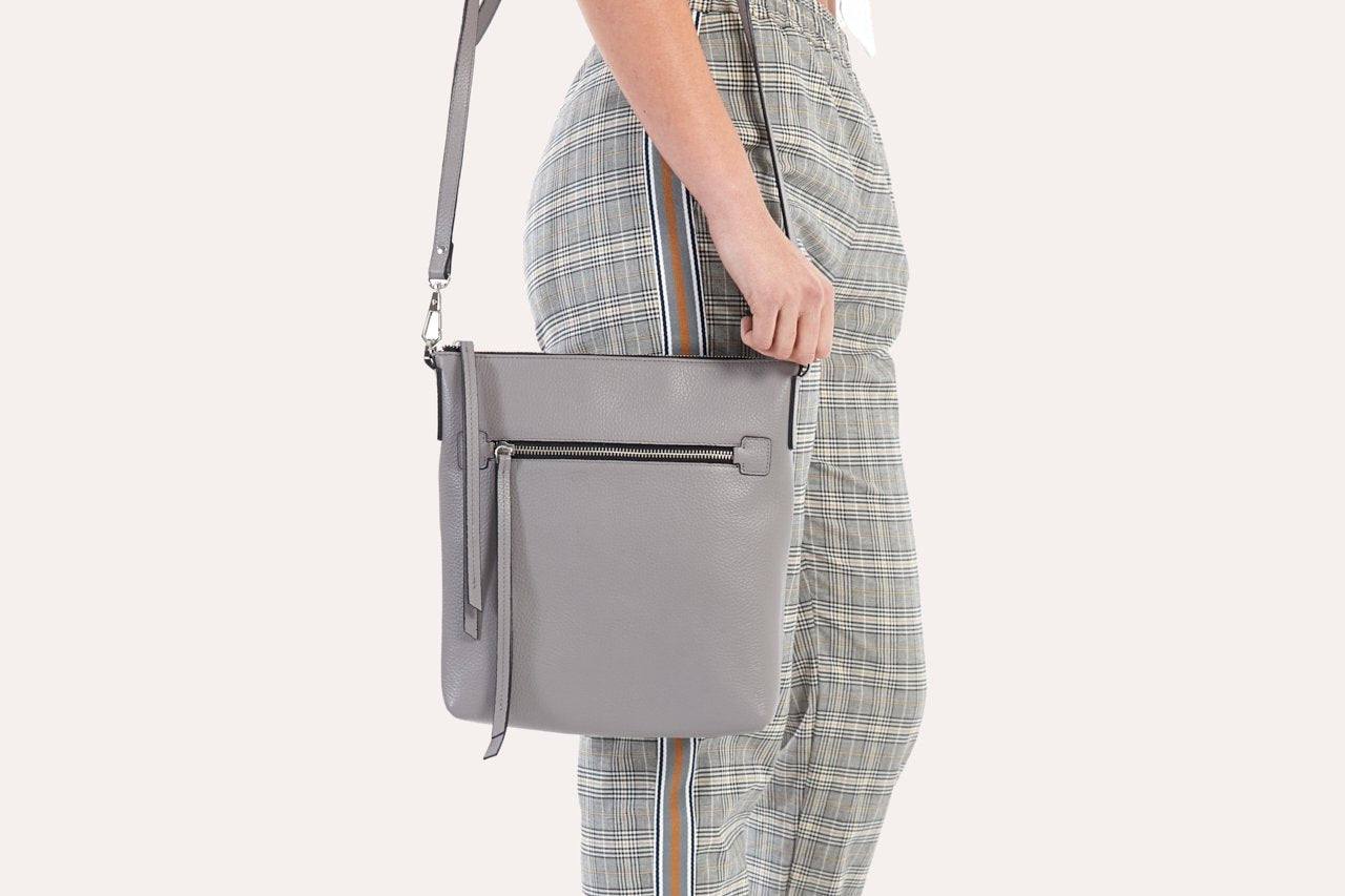 Kiko pebble leather crossbody bag with external zipper pocket and adjustable strap