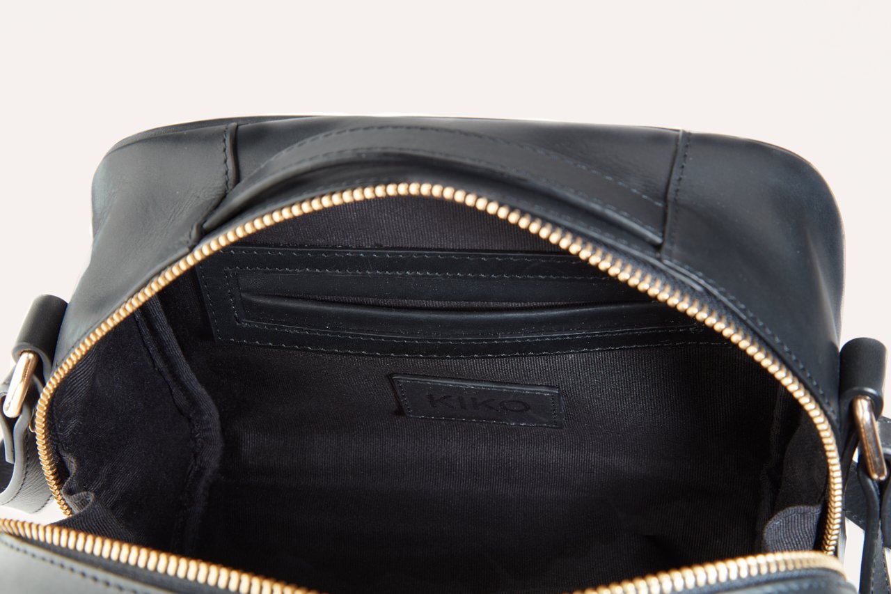 Black genuine leather boxed crossbody bag with top handle and adjustable shoulder strap