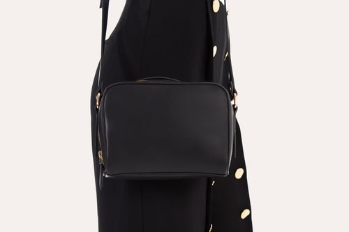 Boxed crossbody bag in genuine leather with top handle and adjustable shoulder strap