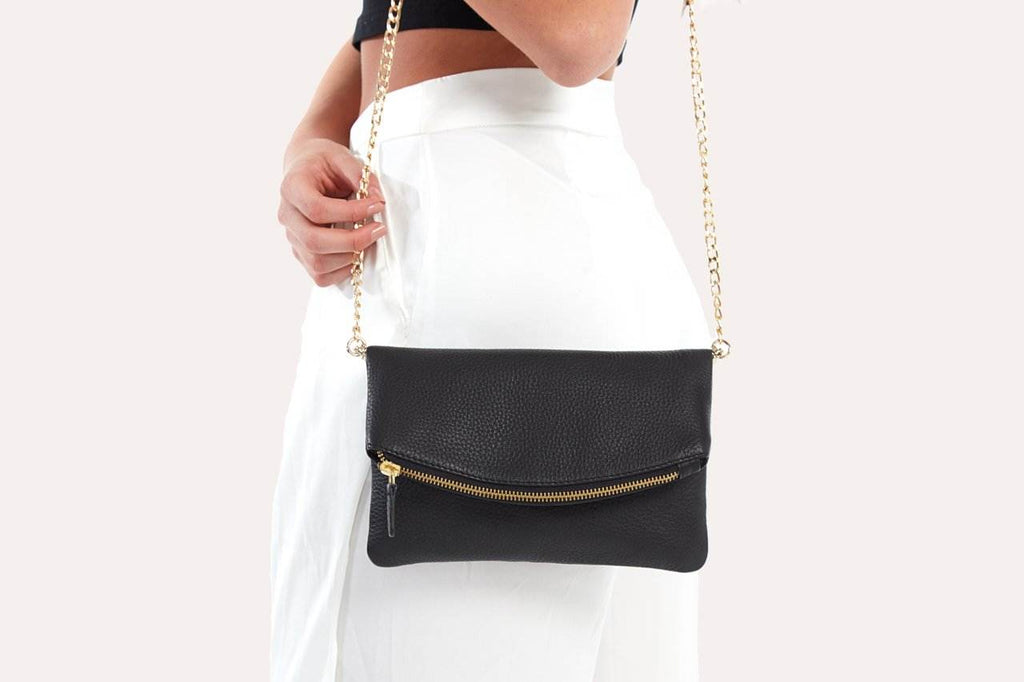 Kiko flap clutch bag in pebble leather with removable chain strap and magnetic closure