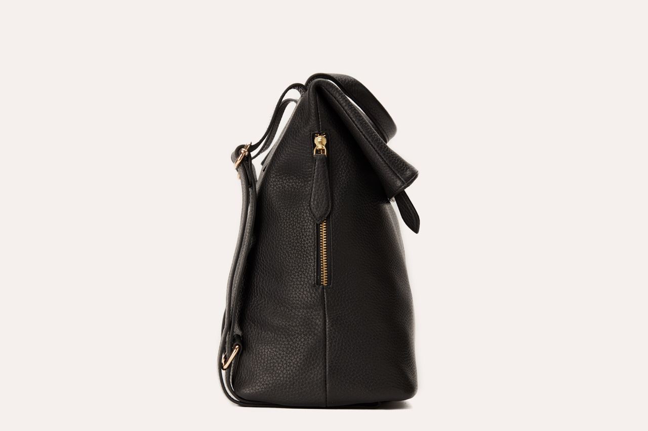 Genuine pebble leather Fold N Go Backpack with adjustable straps and multiple pockets for organized daily use