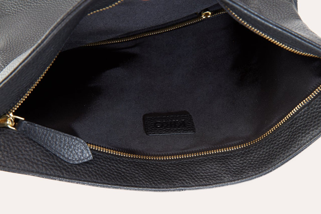 Genuine pebble leather Fold N Go Backpack with adjustable straps and multiple pockets for organized carrying