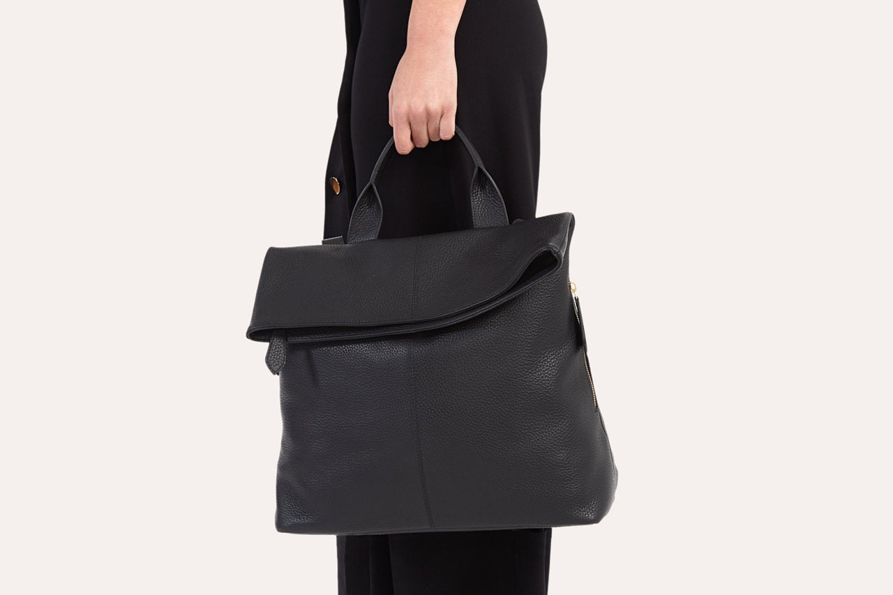 Kiko Fold N Go Backpack in genuine pebble leather with adjustable straps and multiple pockets for organized storage