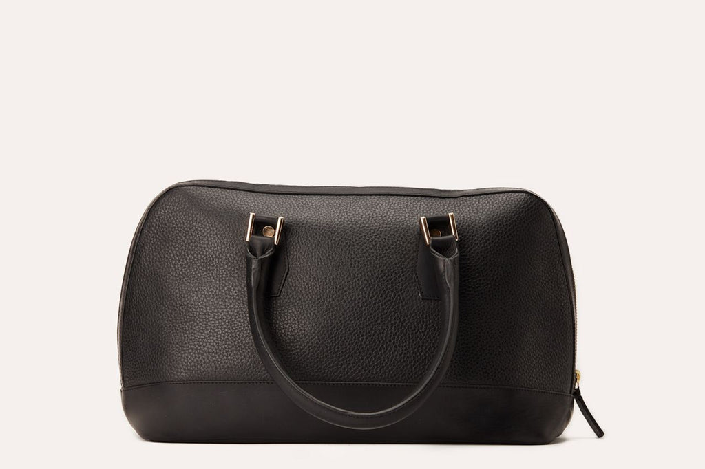 Genuine pebble leather snazzy top-handle bag with top zip closure and internal pocket