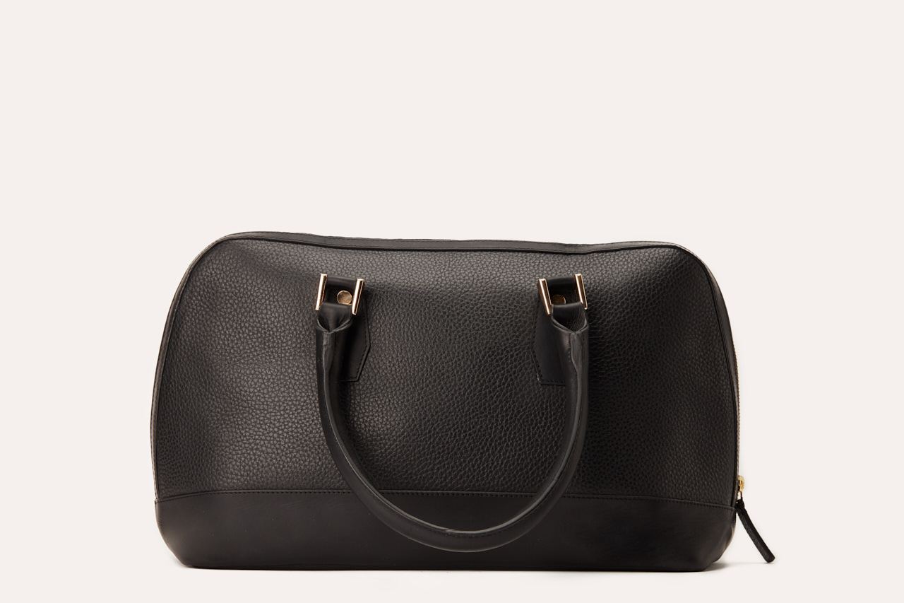 Genuine pebble leather snazzy top-handle bag with top zip closure and internal pocket