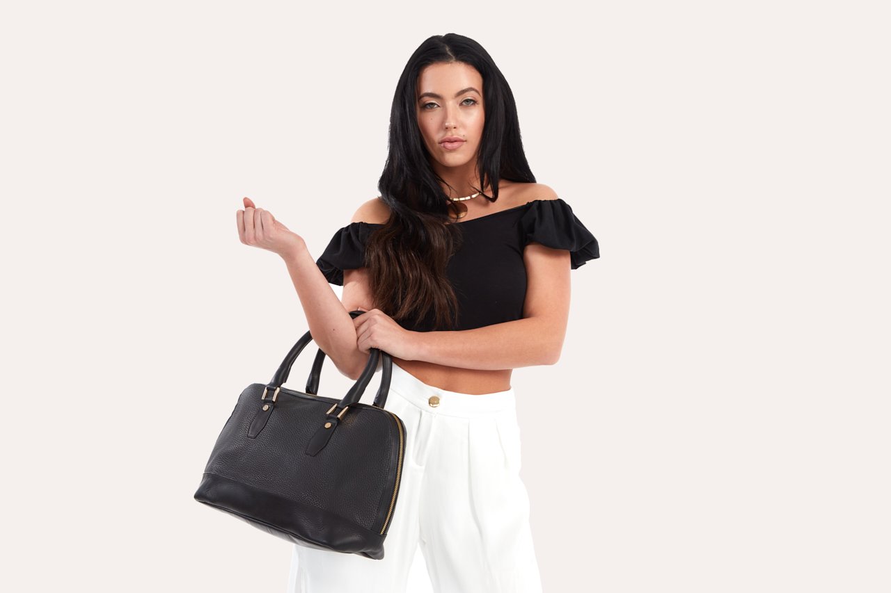 Genuine pebble leather snazzy top-handle bag with top zip closure and internal pocket