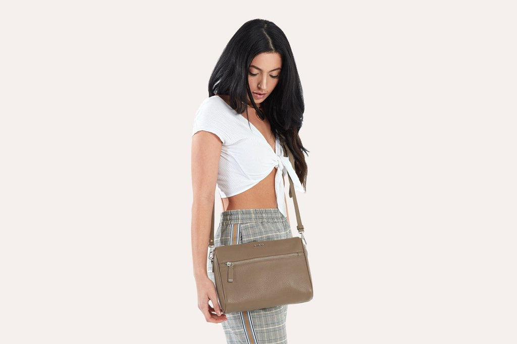 Kiko genuine pebble leather crossbody bag with adjustable strap and zipper pockets