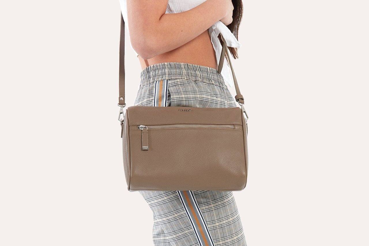 Stylish genuine pebble leather crossbody bag with adjustable strap and zipper pockets