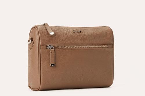 Genuine pebble leather crossbody bag with adjustable strap and multiple pockets for everyday use