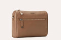 Genuine pebble leather crossbody bag with adjustable strap and multiple pockets for everyday use