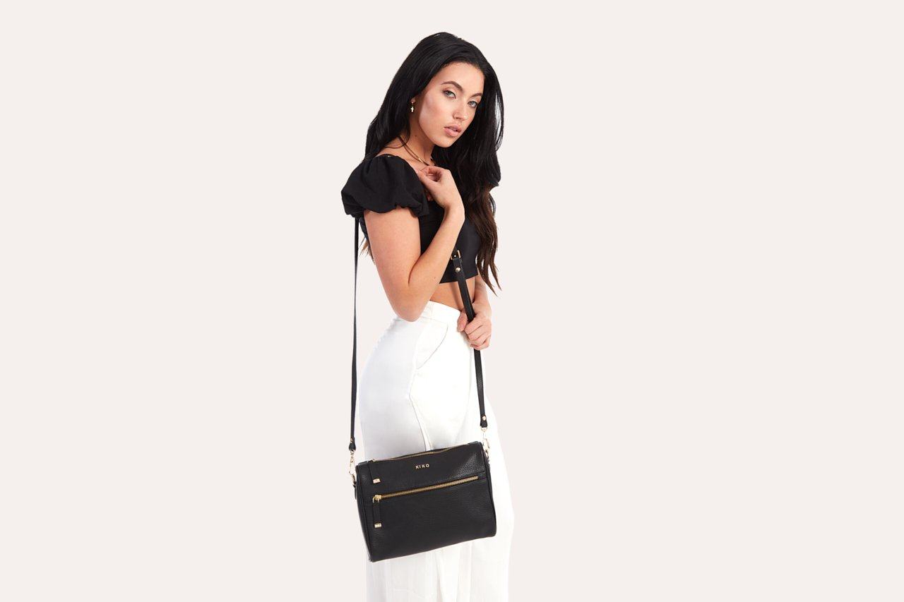 Genuine pebble leather crossbody bag with adjustable strap and zipper pockets
