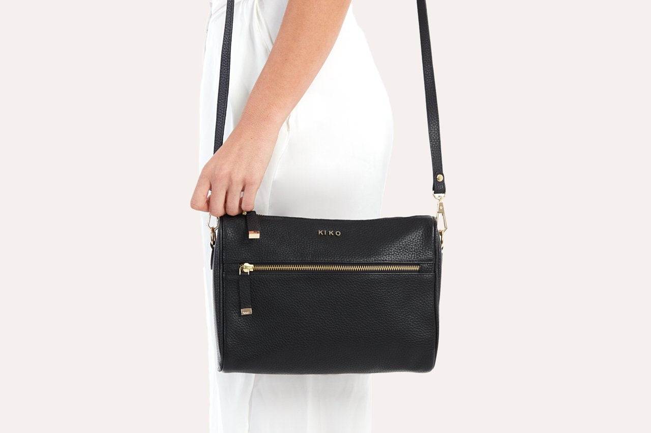 Genuine pebble leather crossbody bag with adjustable strap and multiple pockets for everyday use