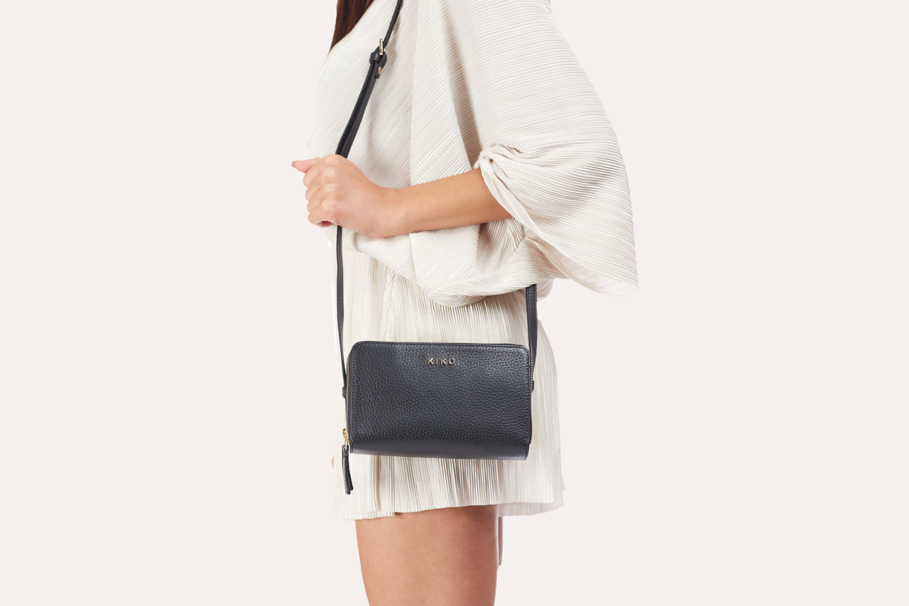Kiko zip around crossbody bag in genuine pebble leather with multiple compartments and adjustable strap