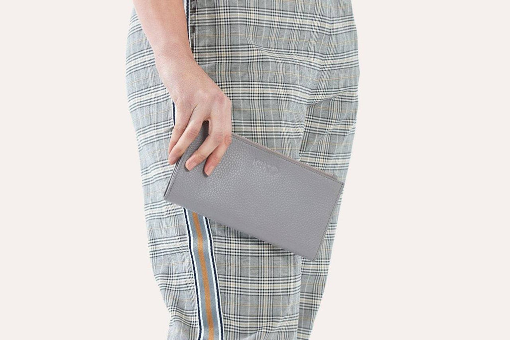 Genuine pebble leather top zip wallet with multiple card and bill slots in rich textured finish