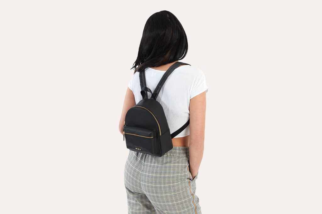 Compact genuine pebble leather backpack with adjustable straps and internal zipper pocket