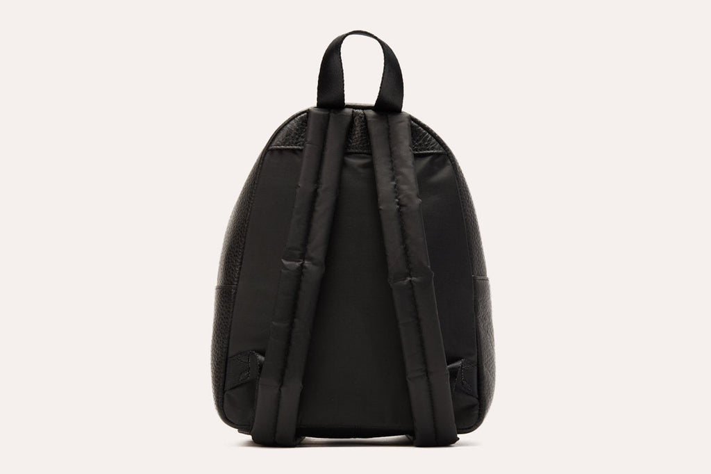 Compact genuine pebble leather backpack with adjustable straps and internal zipper pocket for everyday essentials