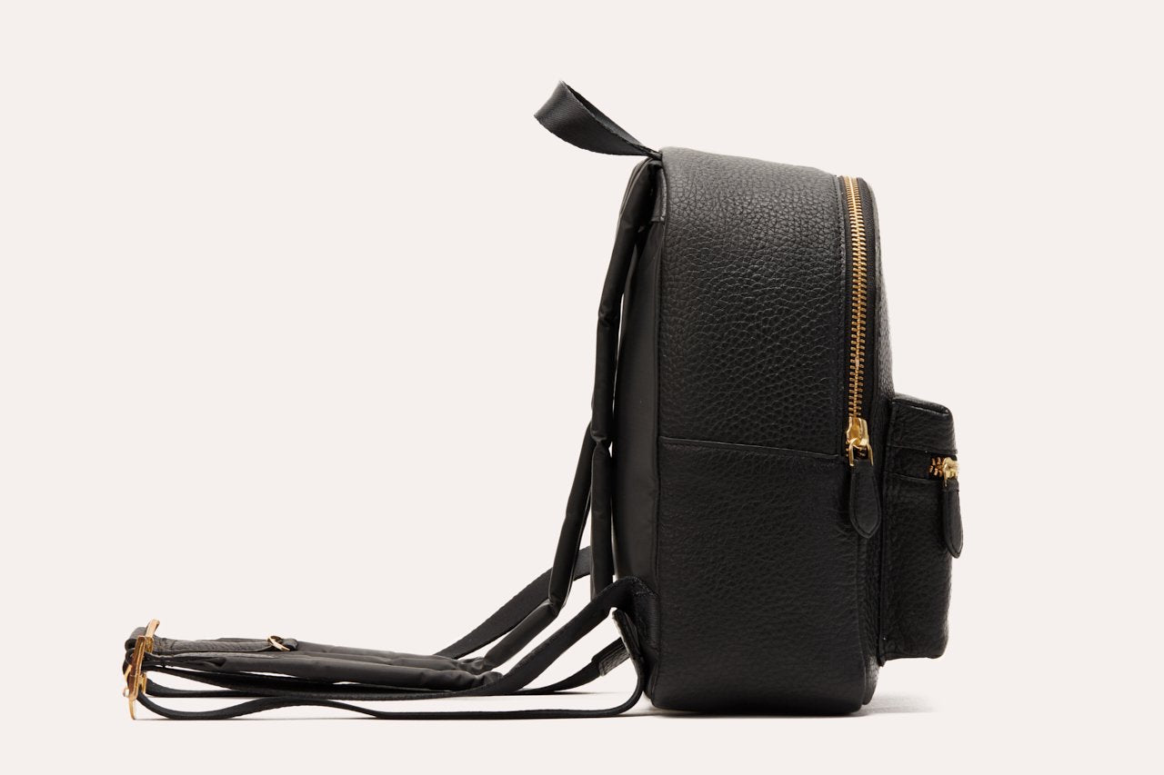 Compact genuine pebble leather backpack with adjustable straps and internal zipper pocket for everyday essentials