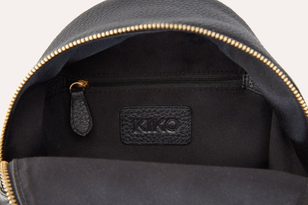 Compact genuine pebble leather backpack with adjustable straps and internal zipper pocket for daily use