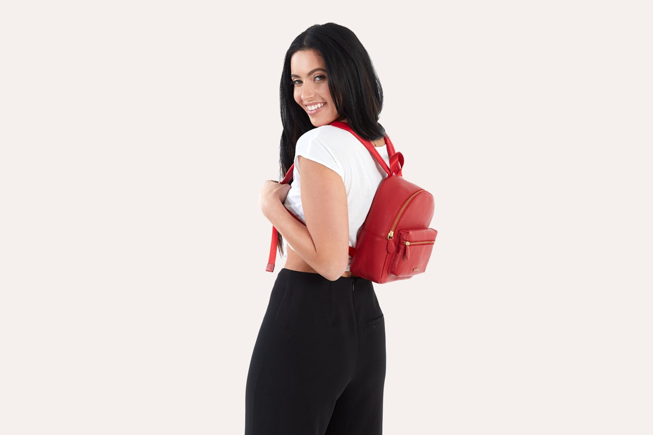Compact genuine pebble leather backpack with adjustable straps and internal zipper pocket for daily use
