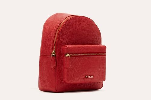 Compact genuine pebble leather backpack with adjustable straps and internal zipper pocket for everyday essentials