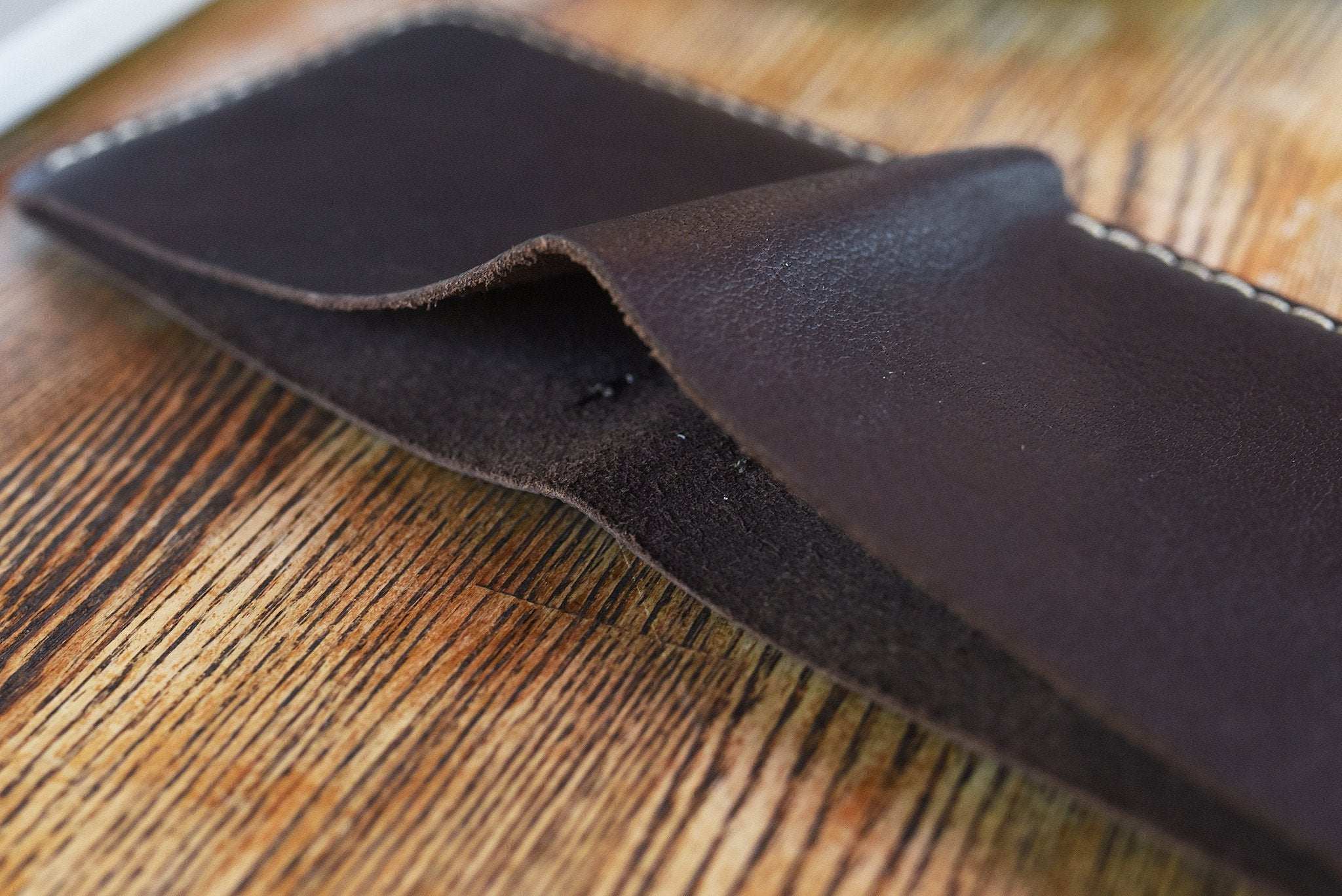 Wave Bifold Leather Wallet with 6 card slots, bill compartment, and light stitching detail