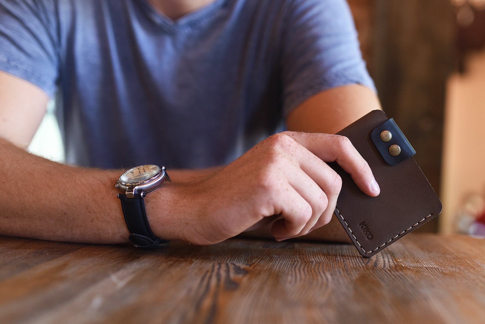 Slim Kiko Card Wallet with smooth leather, brass buttons, and secure flap for stylish card organization