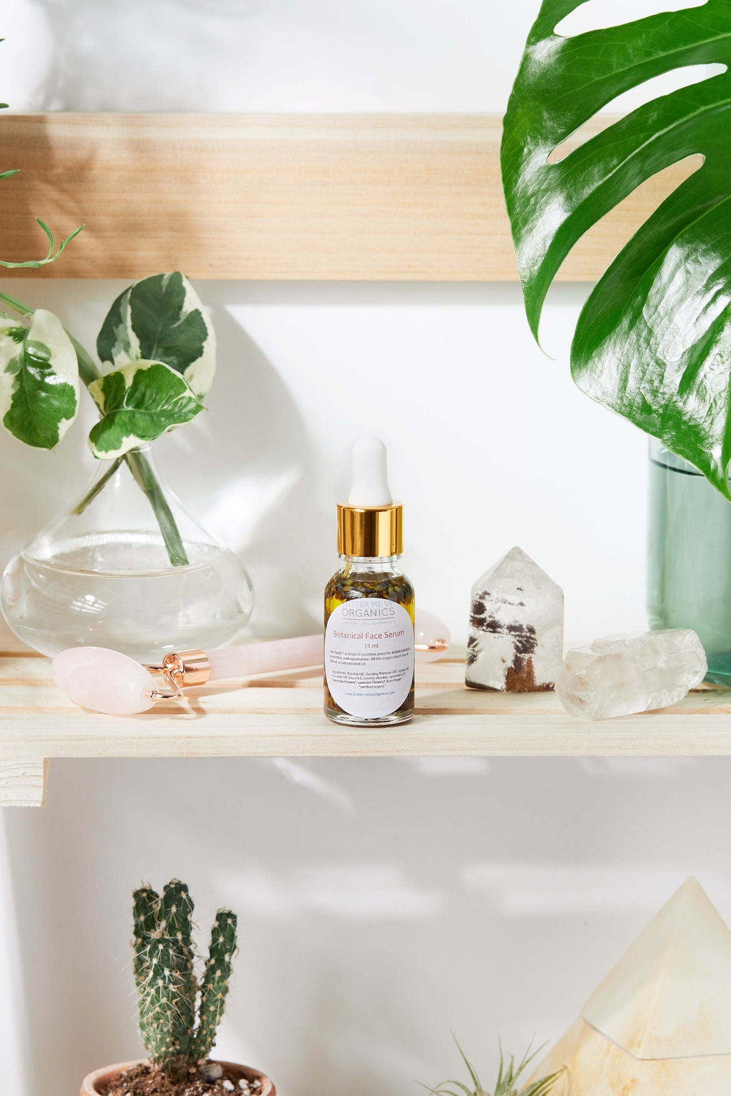 Luxurious healing face serum in elegant Italian glass bottle with yellow oils and herbs by Butter Me Up Organic Anti Aging Youth Facial Serum