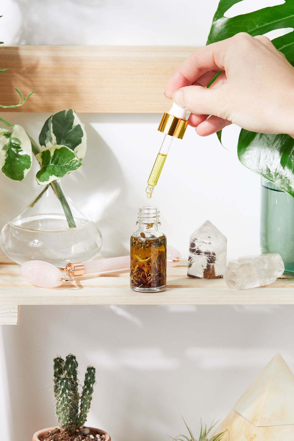 Luxurious Healing Face Serum in elegant Italian glass bottle with yellow oils and healing herbs for organic anti aging and youthful skin