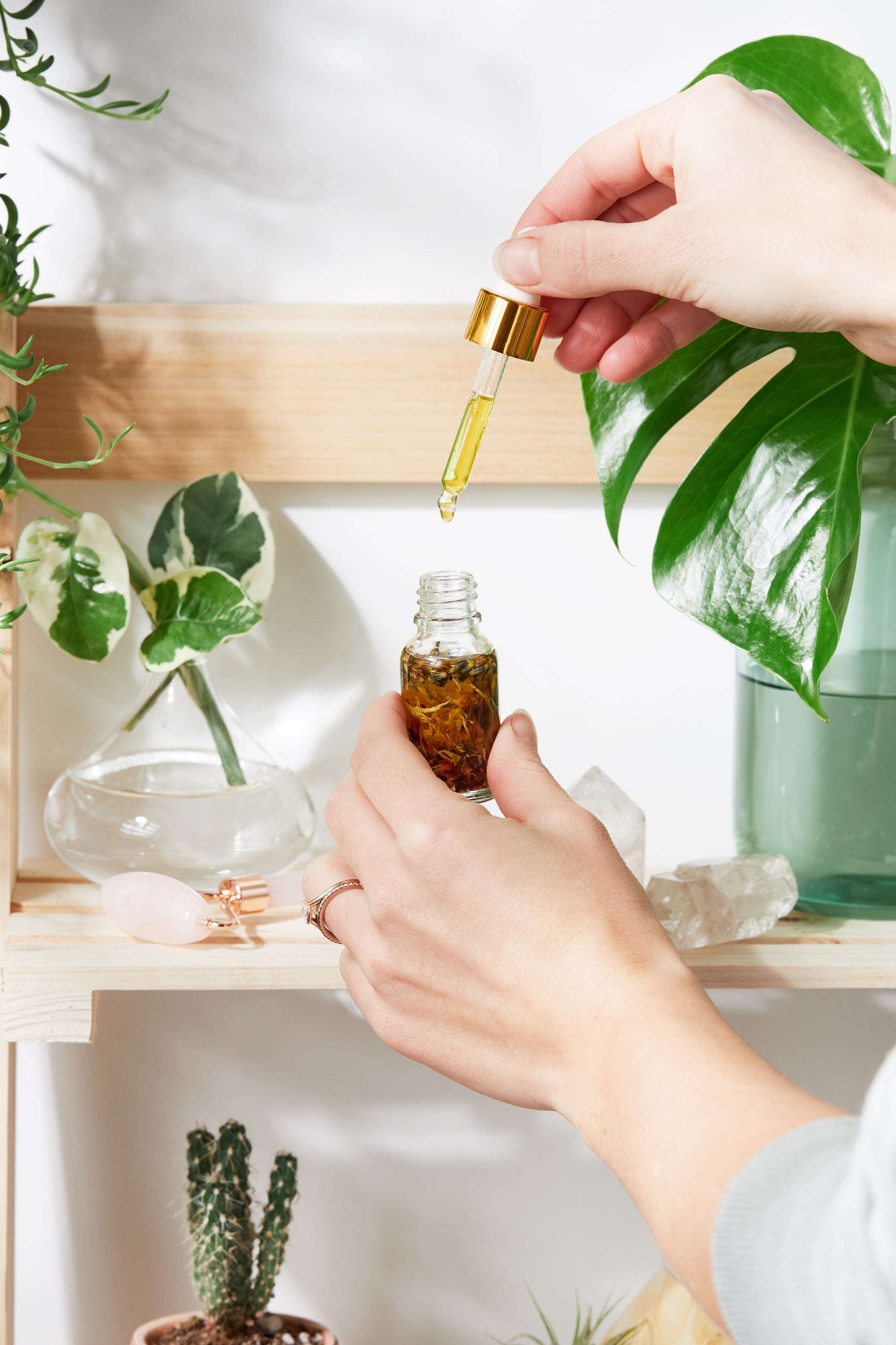 Luxurious Healing Face Serum by Butter Me Up in elegant Italian glass bottle with yellow oils and healing herbs