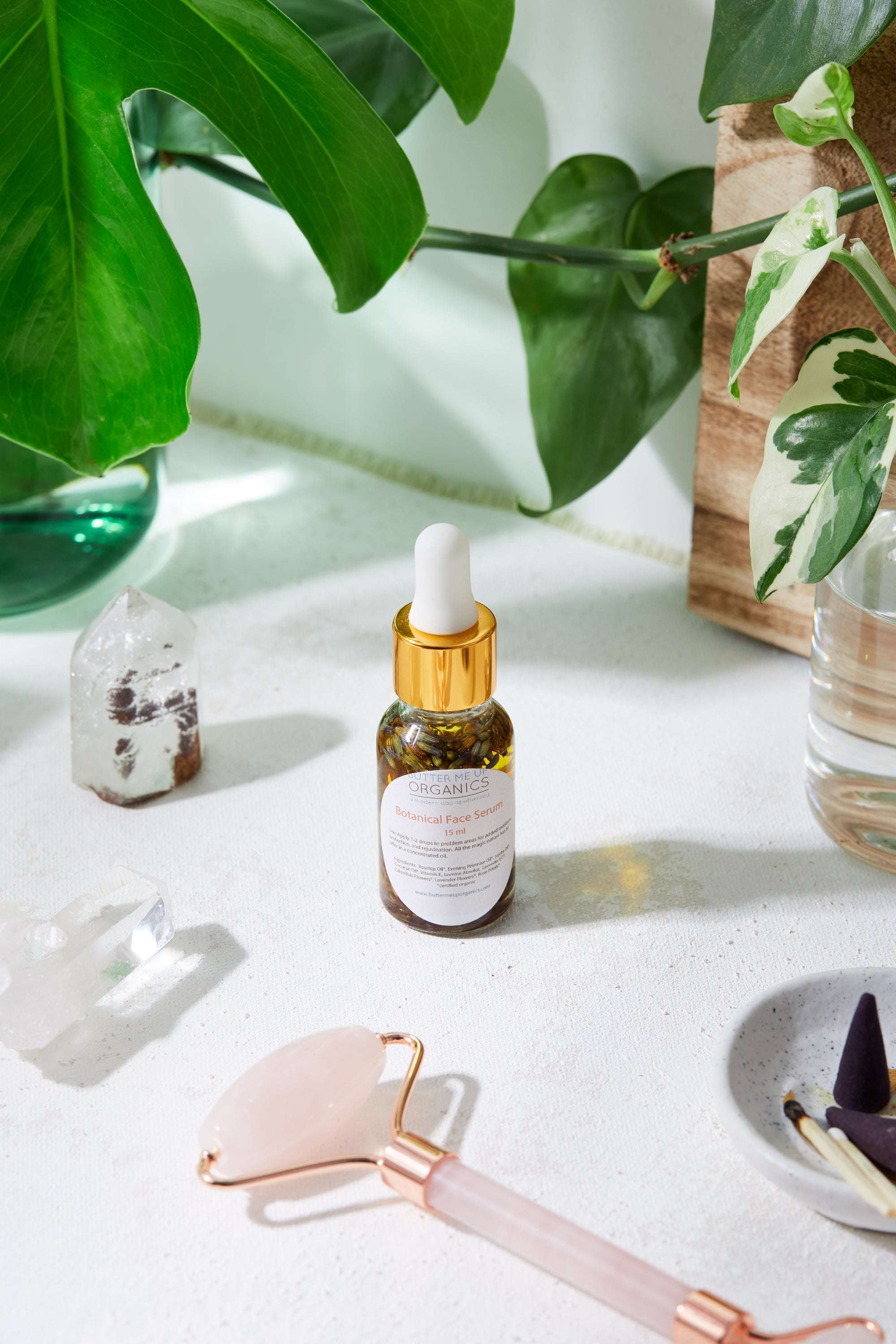 Luxurious healing face serum in elegant Italian glass bottle with organic oils and herbs by Butter Me Up