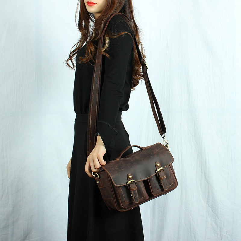 The Faust Leather Crossbody Messenger Bag made of full-grain crazy horse leather with adjustable strap and spacious camera compartments