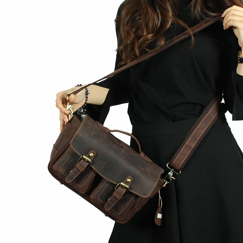 The Faust Leather Crossbody Messenger Bag in full-grain crazy horse leather with adjustable strap and compartments for camera gear