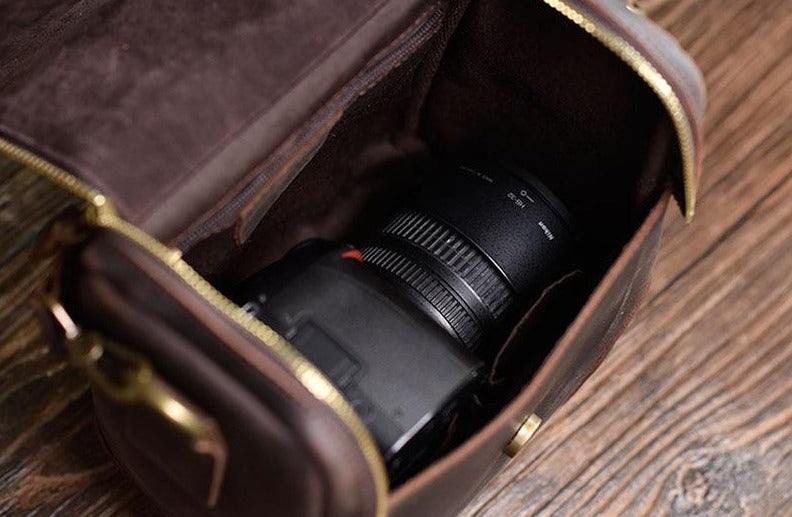 Handcrafted small leather camera bag Calista made from full-grain crazy horse leather with adjustable strap and multiple compartments.