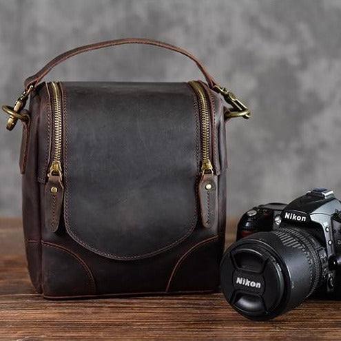Small leather camera bag Calista made of full-grain vegetable-tanned leather with adjustable strap and hand-stitched details.