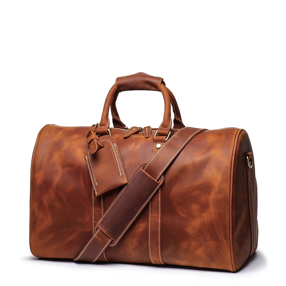 The Brandt Weekender small black leather duffle bag with handles and shoulder strap