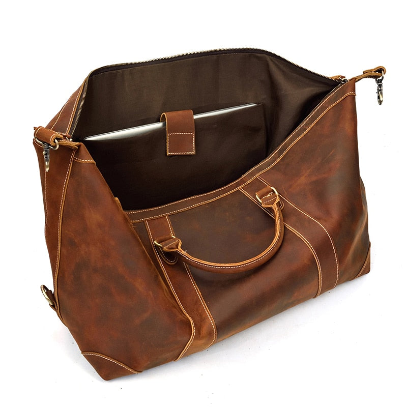 Vintage leather duffle bag made from premium crazy horse leather with spacious compartments and adjustable shoulder strap