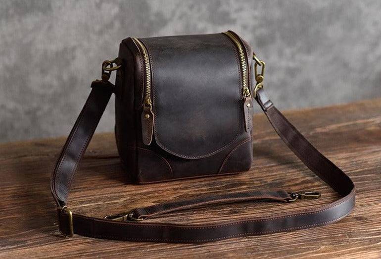 Handcrafted Calista small leather camera bag in full-grain vegetable-tanned crazy horse leather with adjustable shoulder strap and multiple compartments for camera gear.