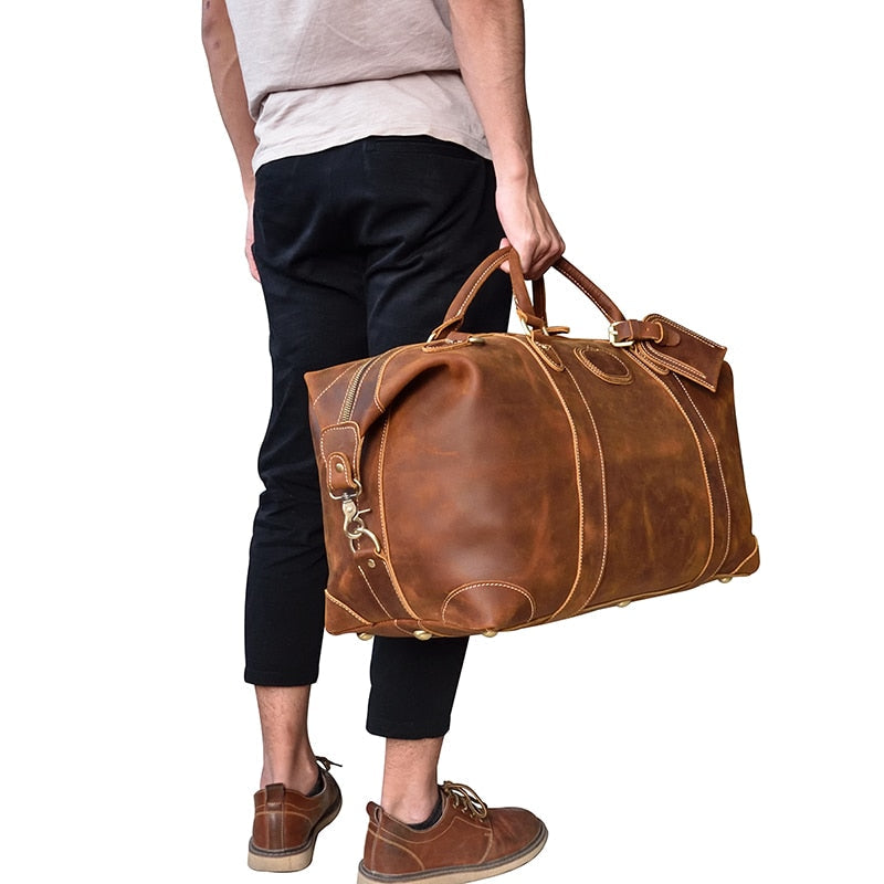 Vintage leather duffle bag made from premium crazy horse leather with spacious compartments and adjustable shoulder strap