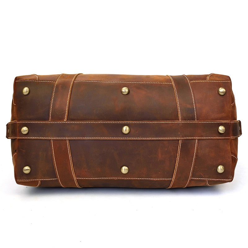 Vintage leather duffle bag in premium crazy horse leather with spacious compartments and adjustable strap