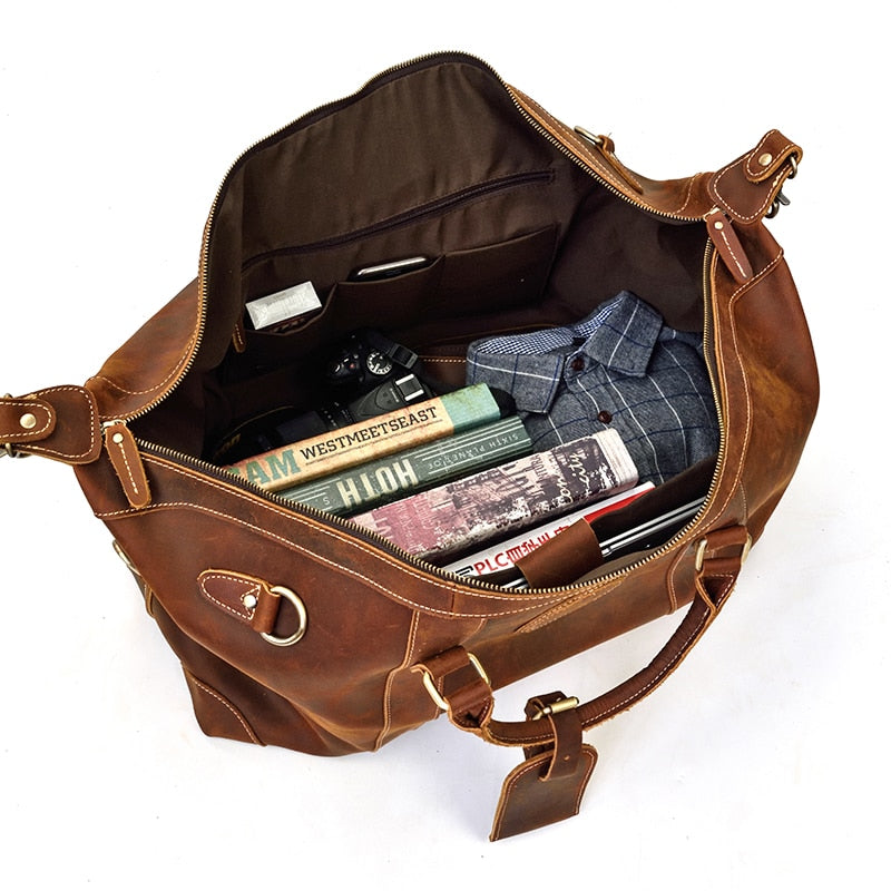 Vintage leather duffle bag made from premium crazy horse leather with spacious compartments and adjustable shoulder strap