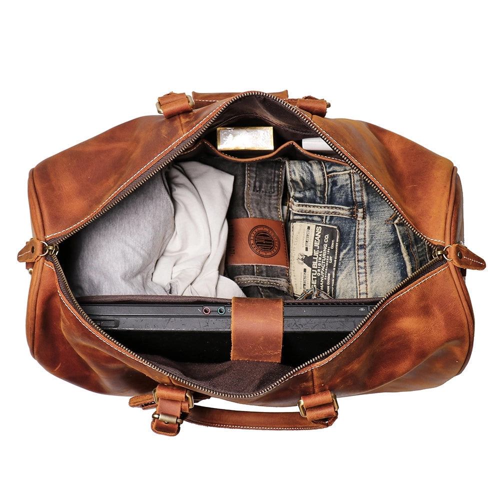 The Brandt Weekender small black leather duffle bag with adjustable strap and shoe compartment
