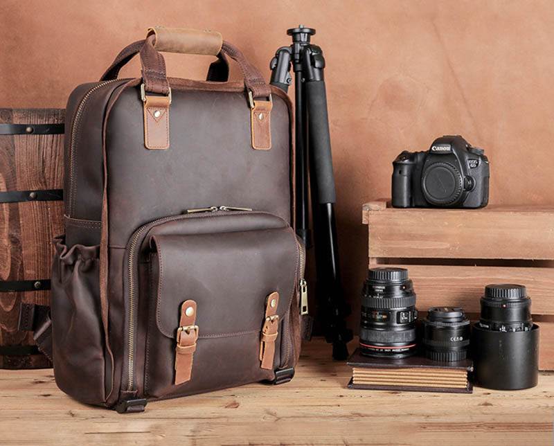 Large Gaetano leather camera bag backpack with padded straps and multiple compartments for photography gear and laptop storage