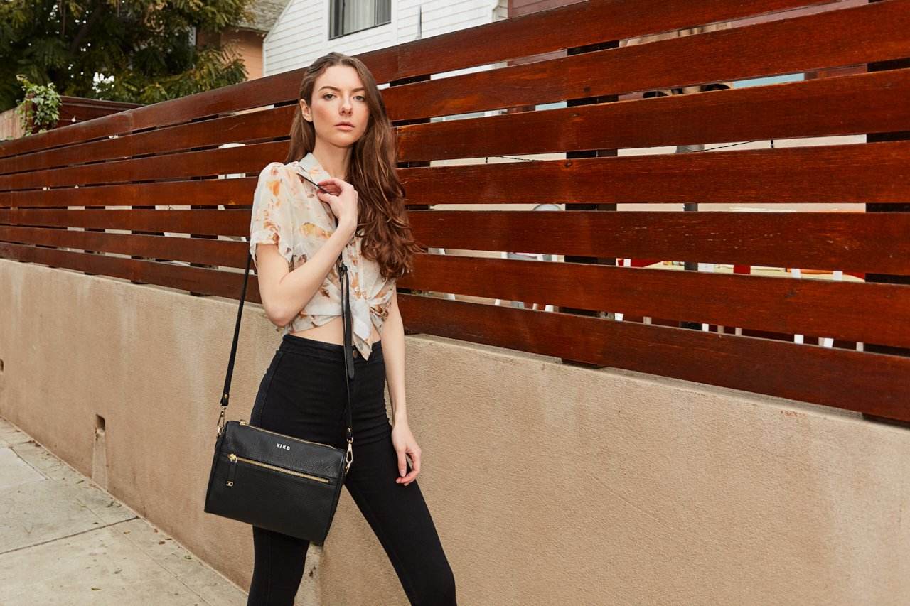 Genuine pebble leather crossbody bag with adjustable strap and multiple pockets for everyday use