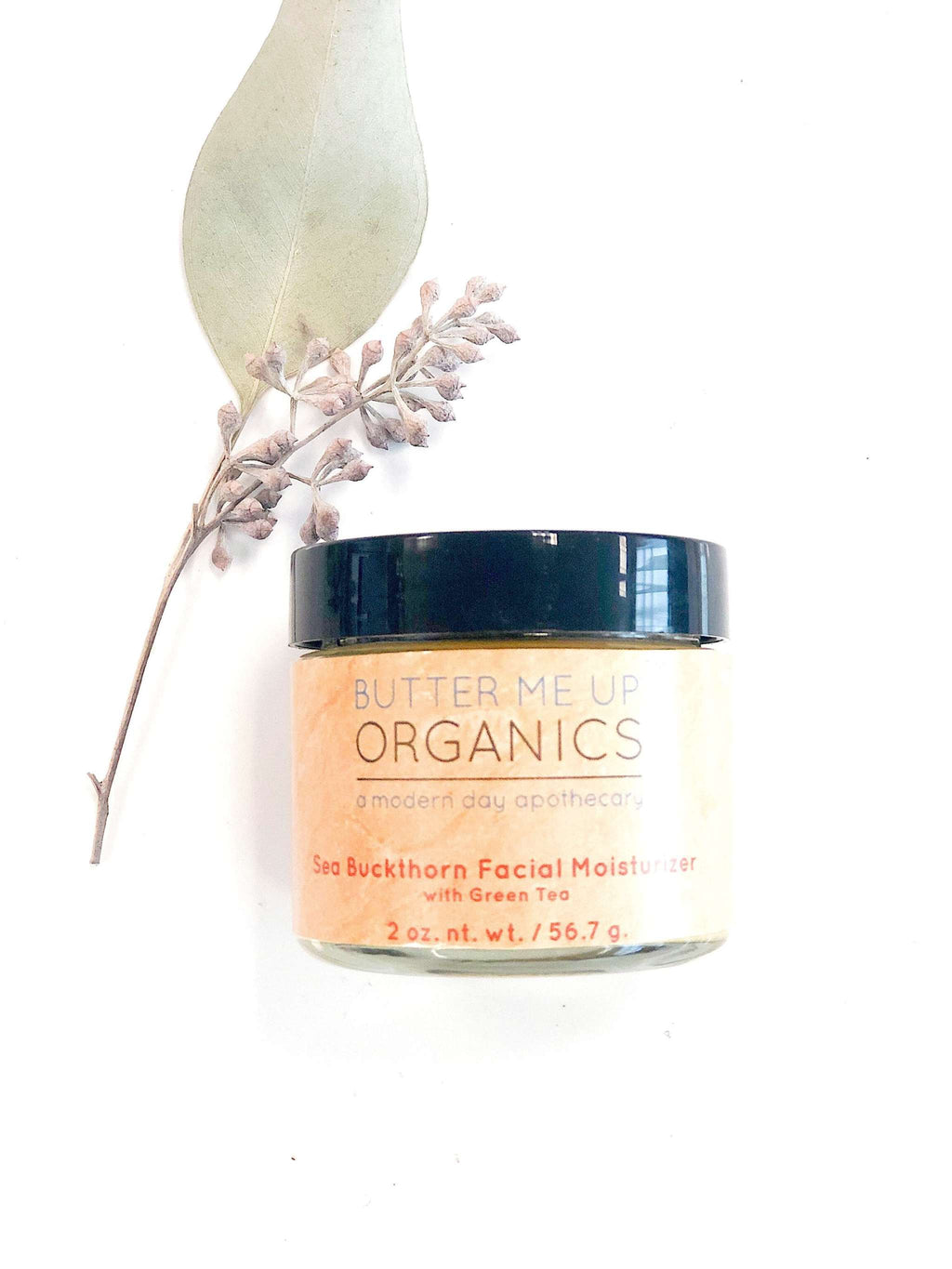 Sea Buckthorn Facial Moisturizer in 2oz glass jar with organic ingredients and natural orange hue