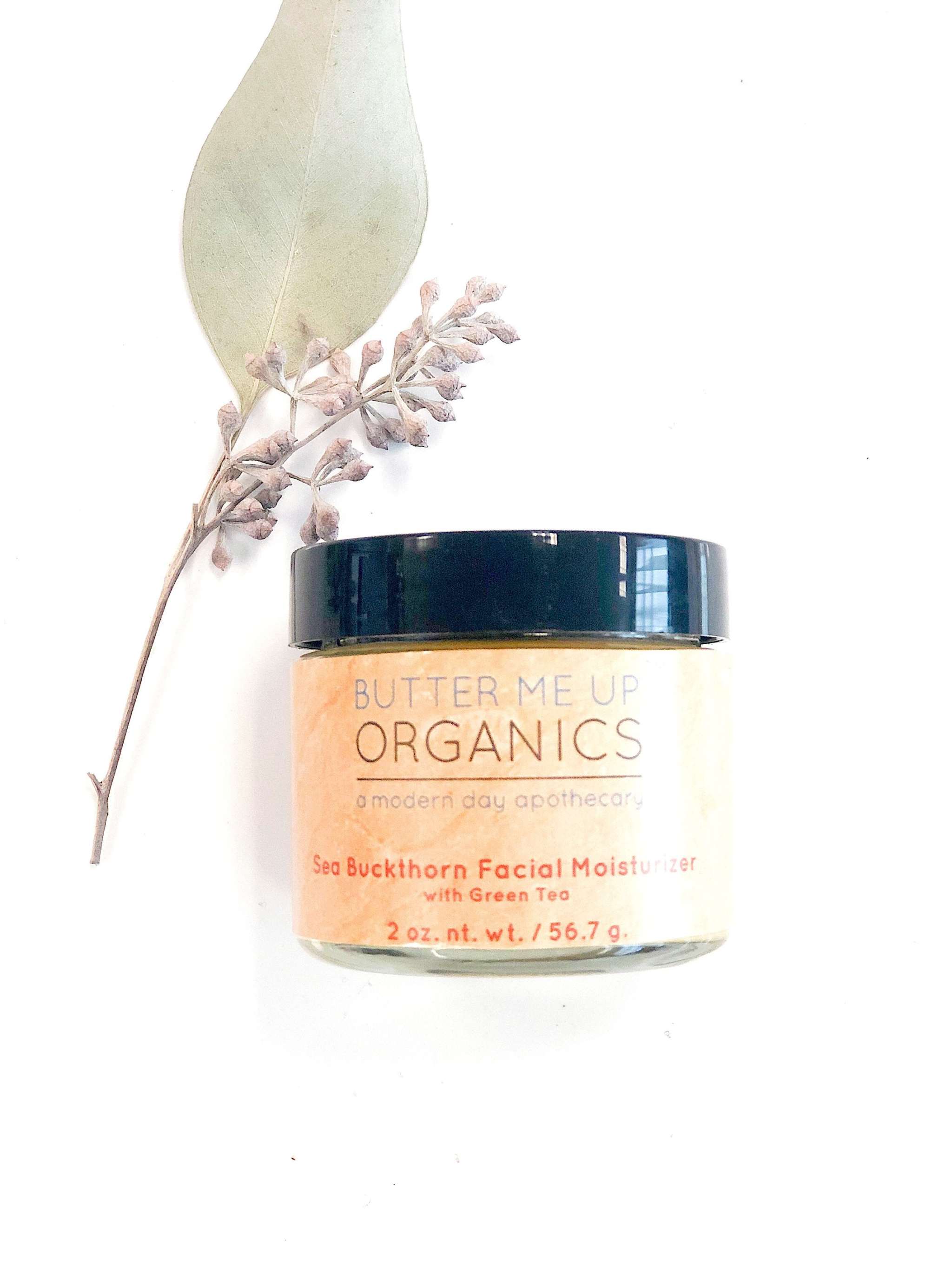 Sea Buckthorn Facial Moisturizer in 2oz glass jar with organic ingredients and natural orange hue